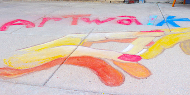 Sidewalk chalk spelling Art Walk