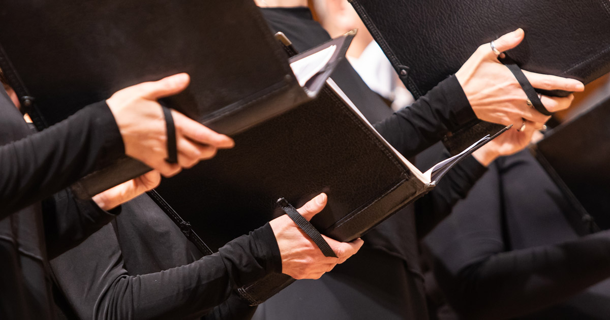 Choir holding books